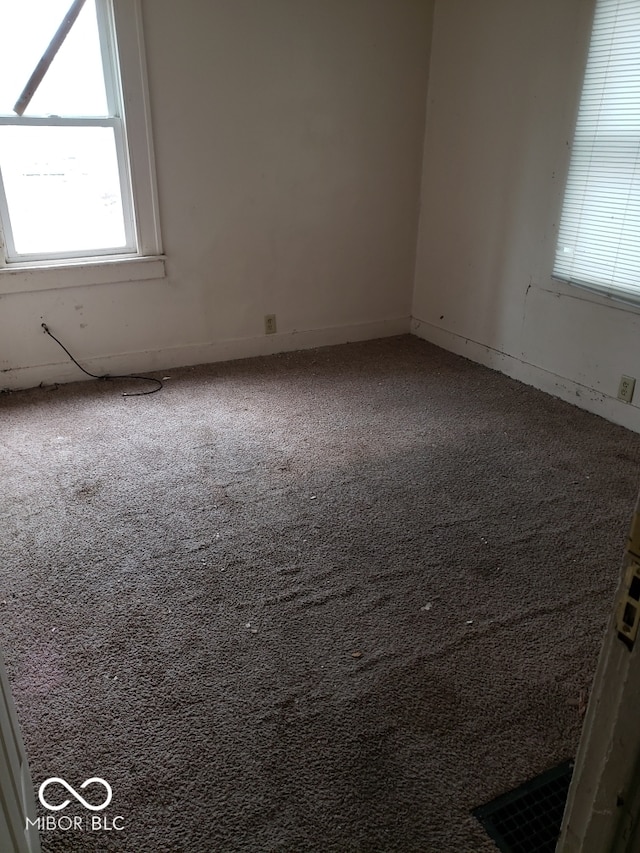 spare room featuring carpet flooring