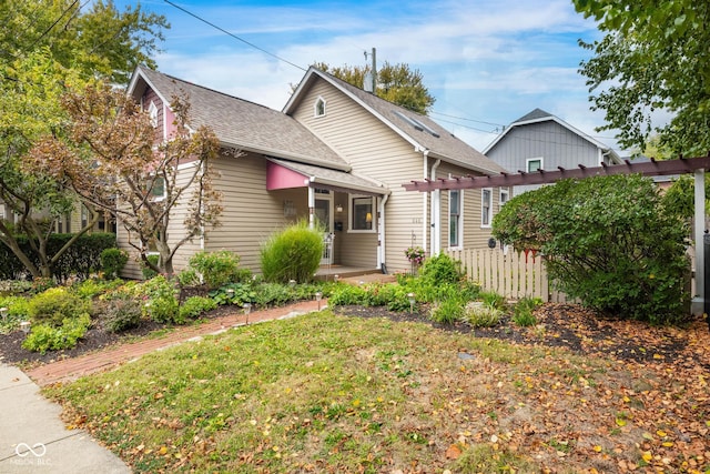 bungalow-style home with a front lawn