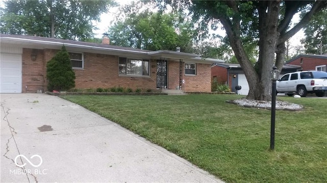 ranch-style house featuring a garage and a front yard