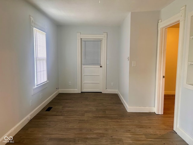 interior space with dark hardwood / wood-style floors