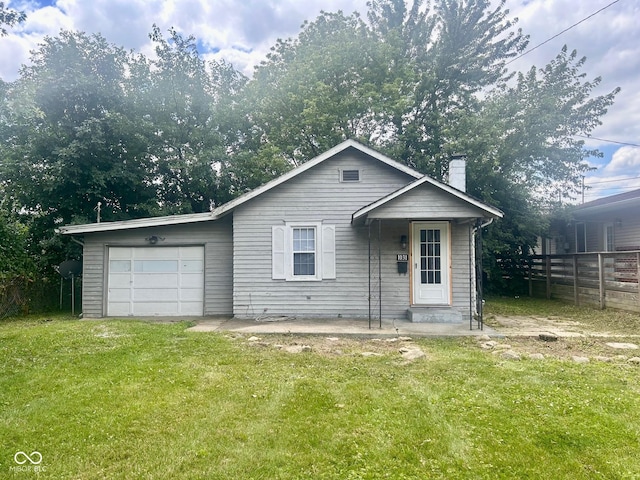 view of front facade featuring a garage and a front yard