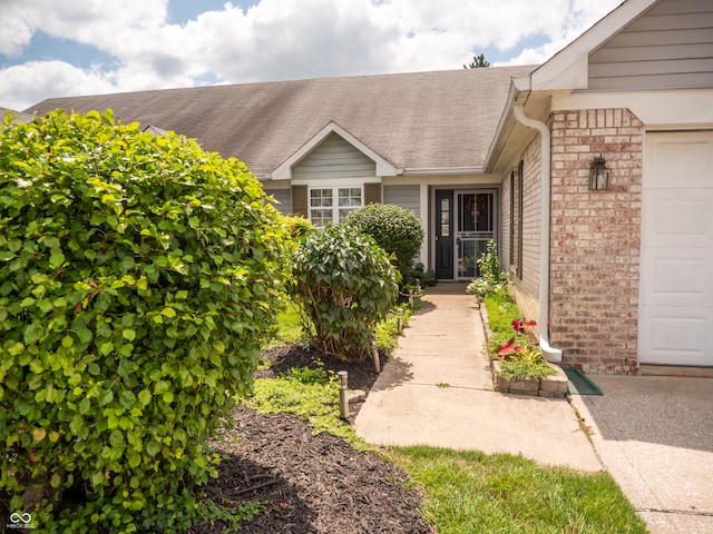 property entrance with a garage