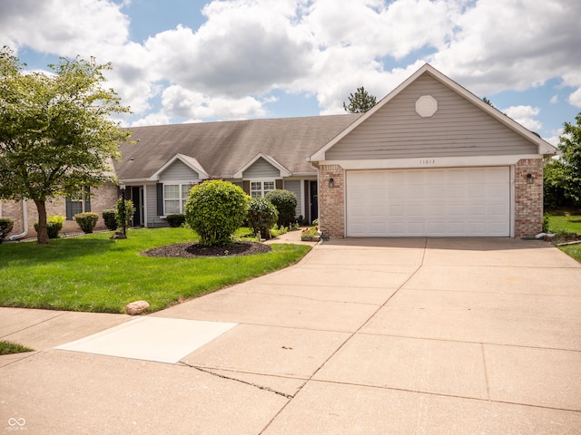 ranch-style house with a garage and a front yard