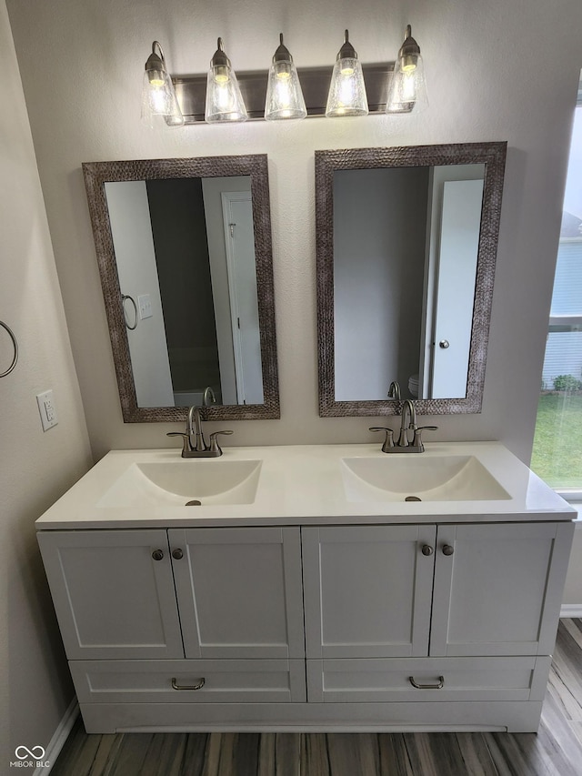 bathroom featuring hardwood / wood-style flooring and vanity