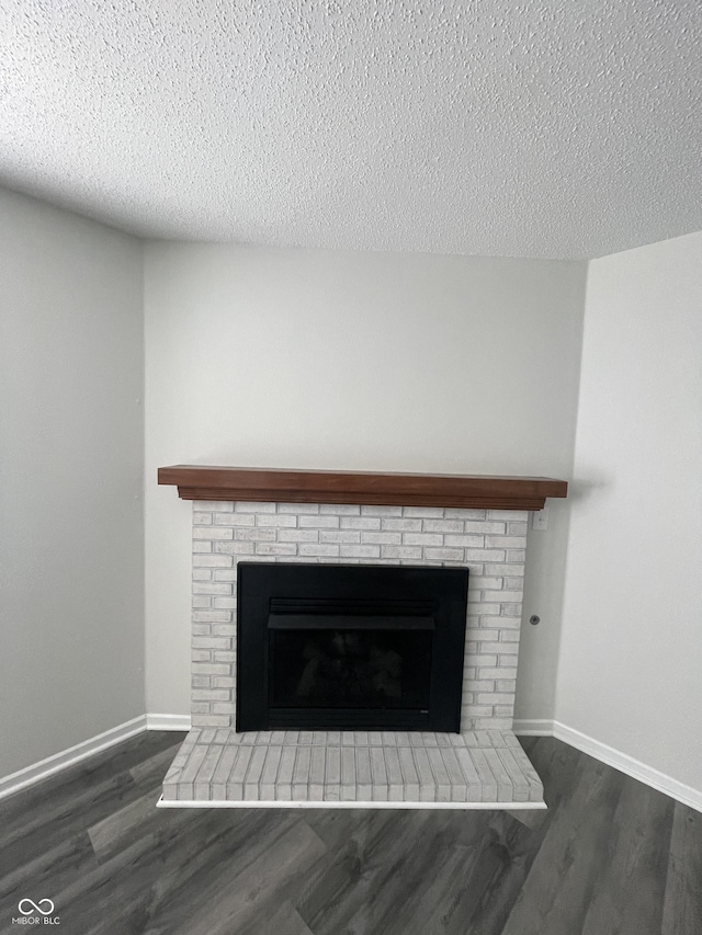 details with hardwood / wood-style flooring and a textured ceiling