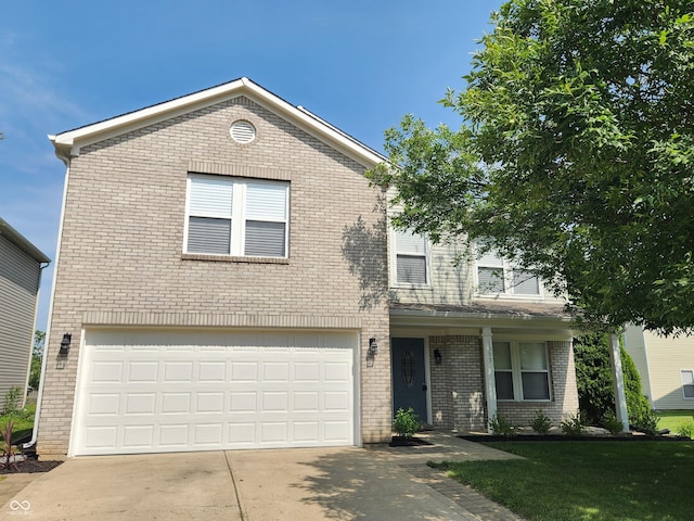 view of front of house with a garage and a front yard