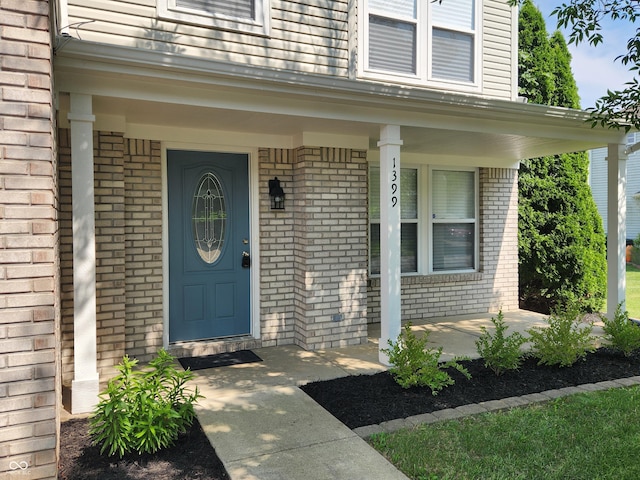 entrance to property featuring covered porch