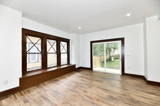 unfurnished room featuring wood-type flooring