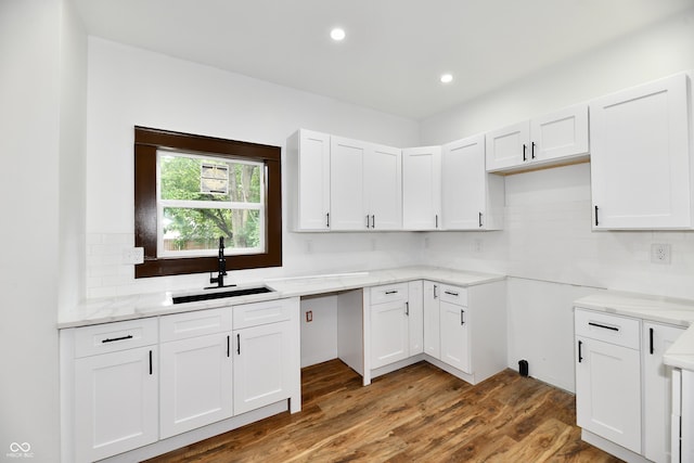 kitchen featuring white cabinetry, sink, and dark wood-type flooring