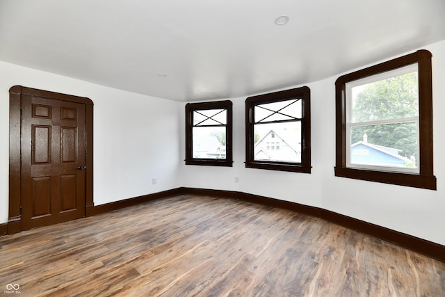 spare room featuring hardwood / wood-style floors