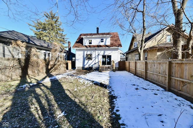 view of snow covered house