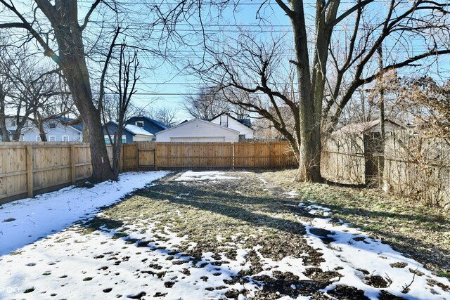 view of yard covered in snow