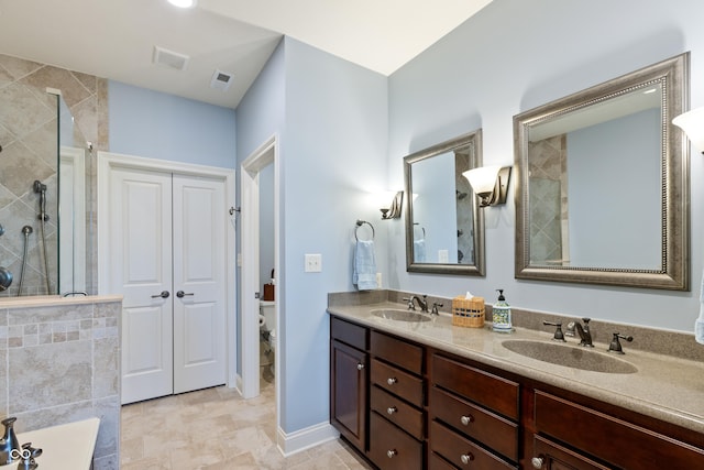 bathroom with vanity, toilet, and an enclosed shower