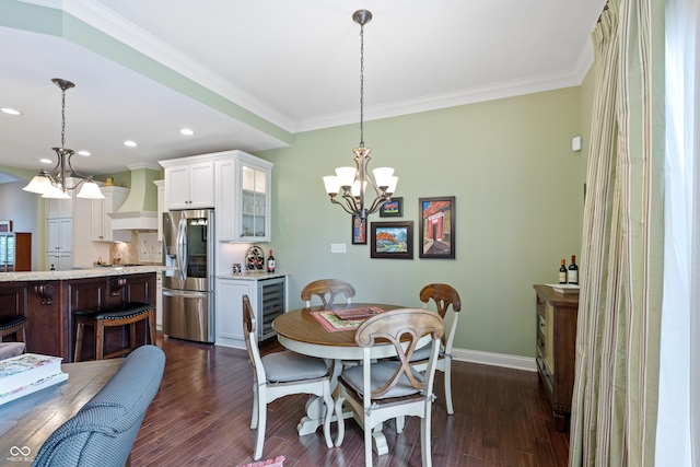 dining space featuring wine cooler, dark hardwood / wood-style floors, crown molding, and an inviting chandelier