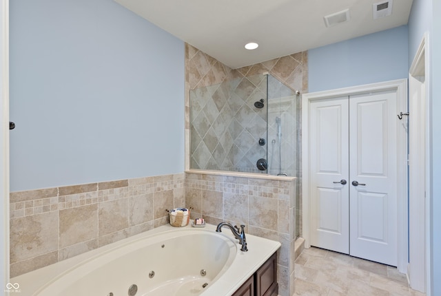 bathroom featuring shower with separate bathtub