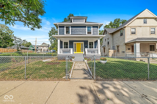 view of front of property featuring a front yard and a porch