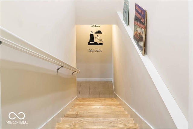 staircase with tile patterned floors