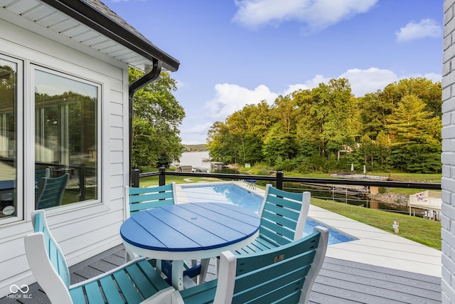 wooden terrace with a lawn