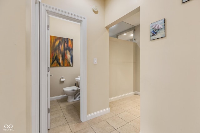 bathroom with tile patterned flooring and toilet