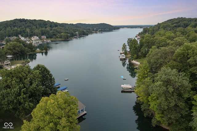 aerial view at dusk with a water view