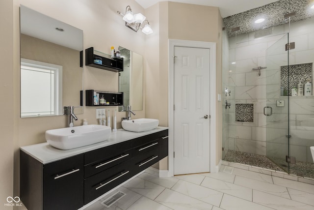 bathroom featuring vanity and an enclosed shower