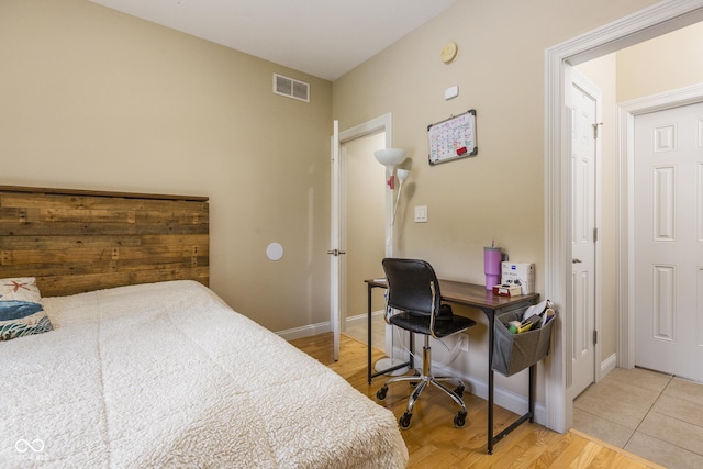 bedroom with light wood-type flooring