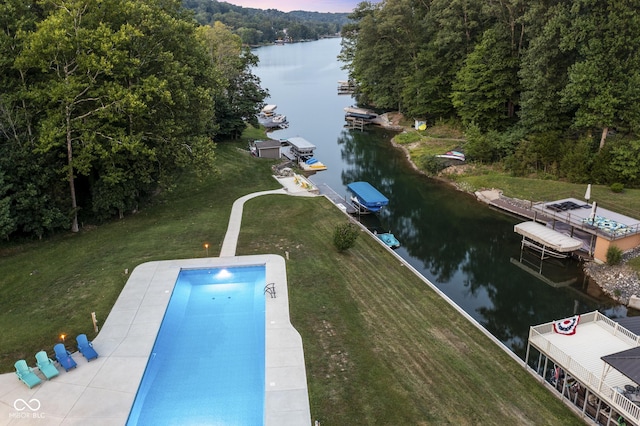 aerial view at dusk with a water view