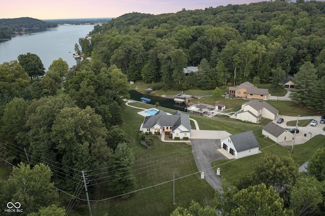 aerial view at dusk with a water view