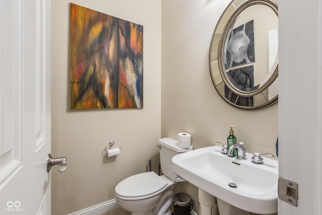 bathroom with sink and toilet