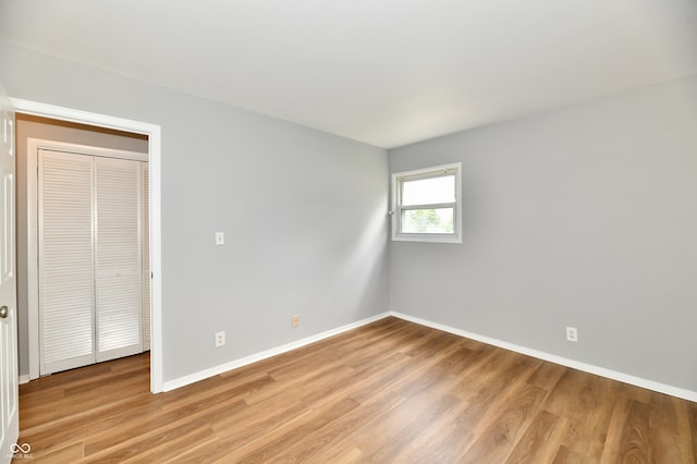 unfurnished room featuring hardwood / wood-style flooring