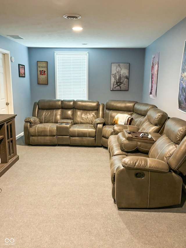 carpeted living area featuring visible vents