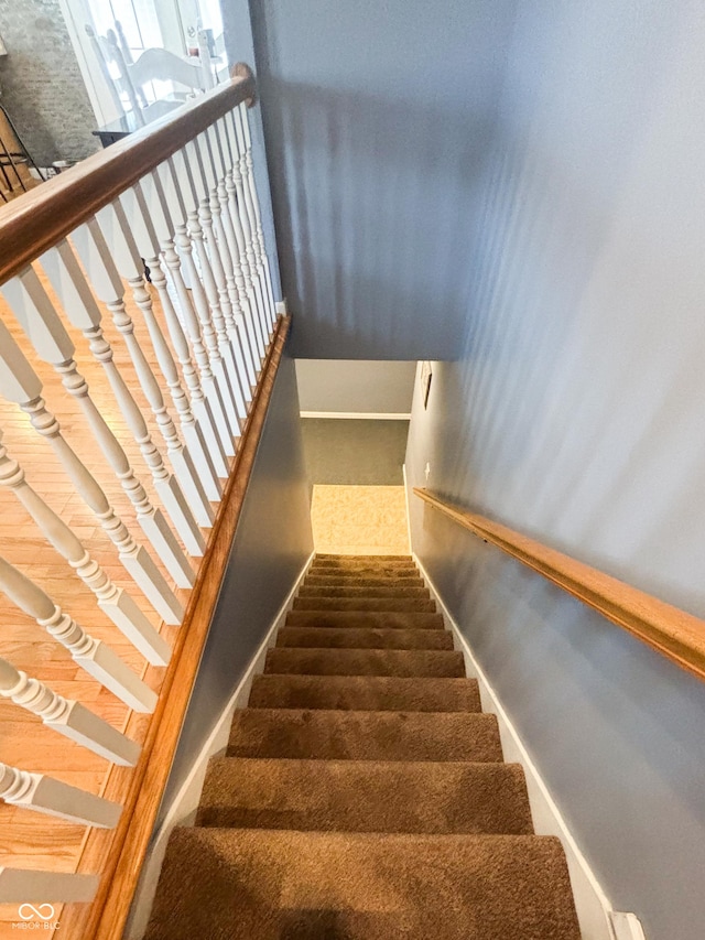 stairs featuring baseboards