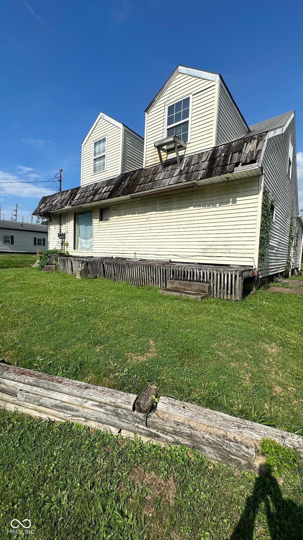 view of home's exterior featuring a lawn