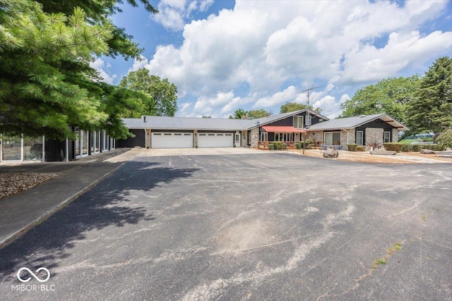 ranch-style house featuring a garage