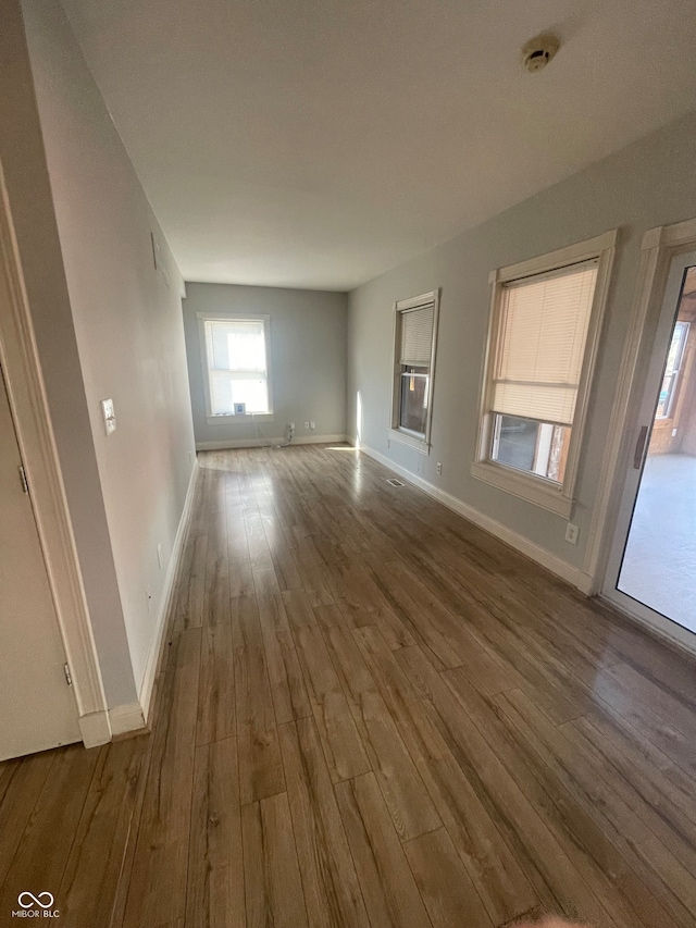 spare room with wood-type flooring