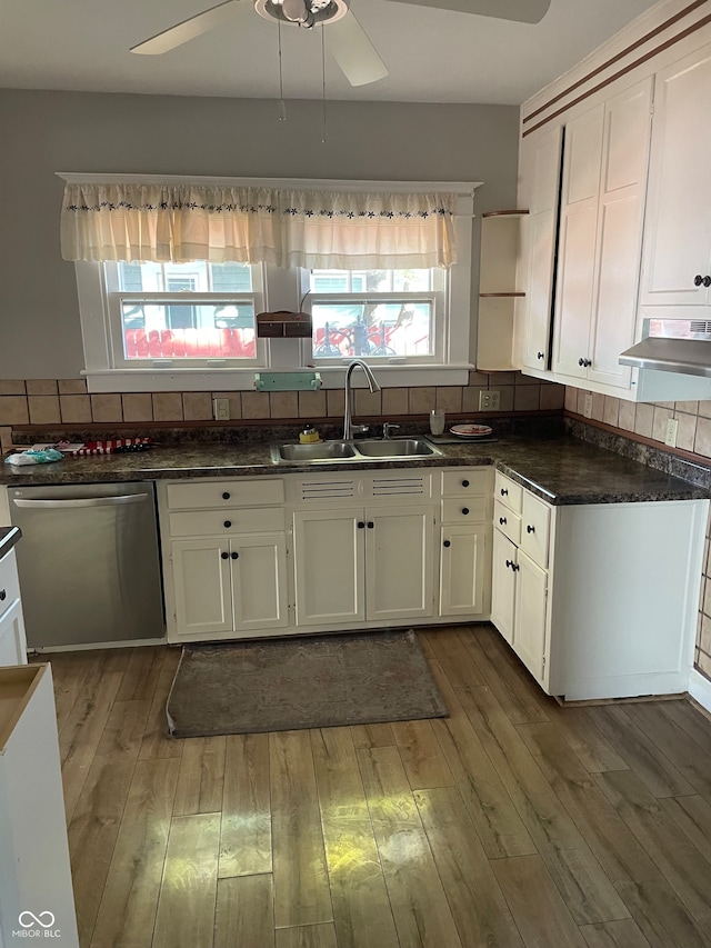 kitchen with white cabinets, stainless steel dishwasher, dark wood-type flooring, and sink