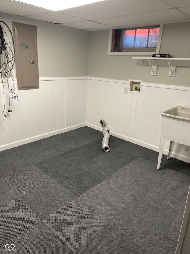 washroom featuring hookup for a washing machine, dark carpet, and electric panel