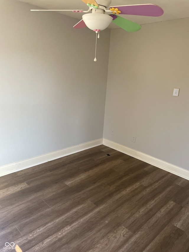 spare room with dark hardwood / wood-style flooring