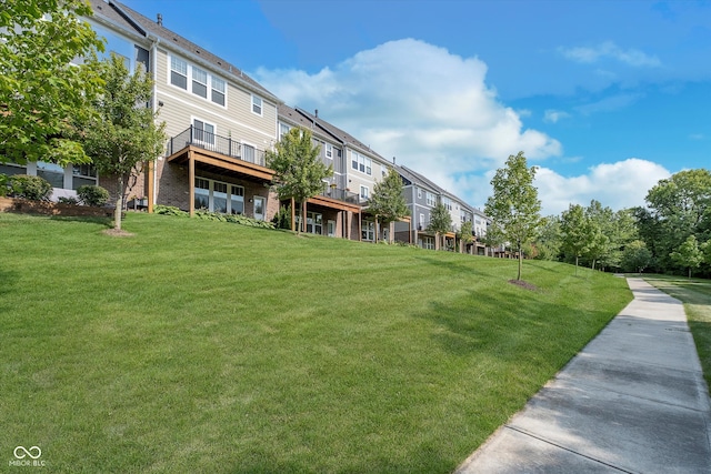 view of property's community with a yard