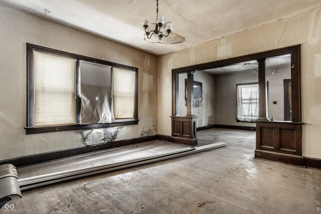 misc room featuring light hardwood / wood-style floors and a chandelier