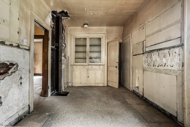 interior space with tile patterned floors