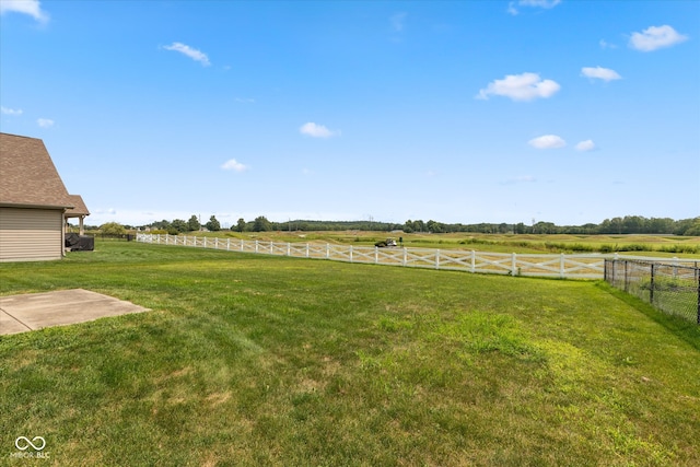 view of yard with a rural view