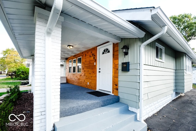 entrance to property with a porch