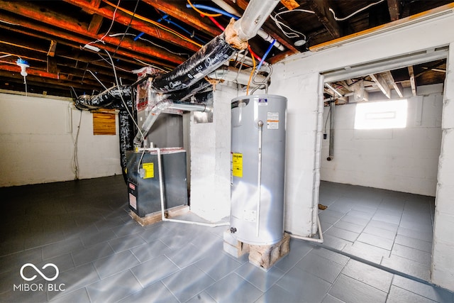 basement featuring water heater and heating unit