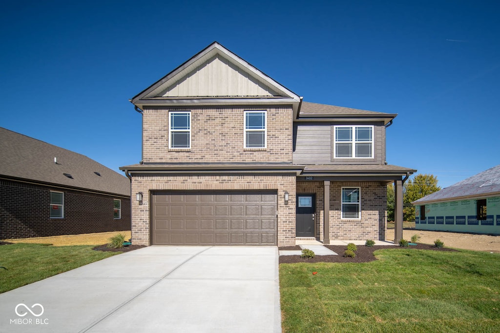 craftsman inspired home featuring a garage, brick siding, concrete driveway, board and batten siding, and a front yard