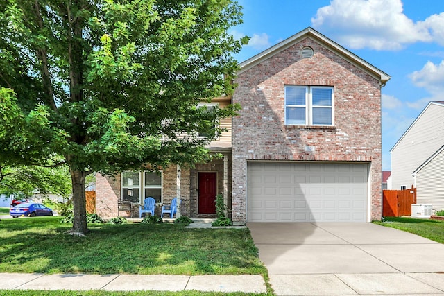 view of front of property featuring a garage and a front lawn