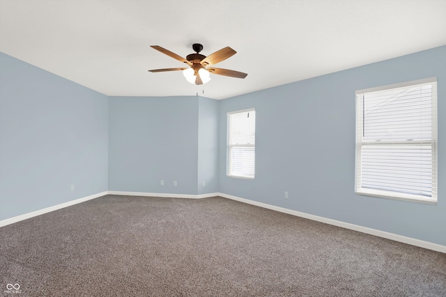 spare room with ceiling fan and carpet flooring