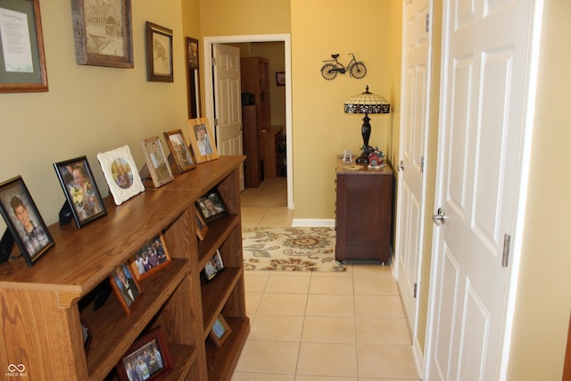 hallway featuring light tile patterned floors