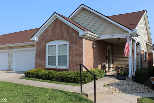 view of front facade featuring a garage and covered porch