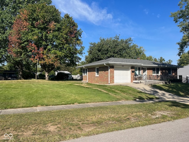 view of side of home with a garage and a lawn